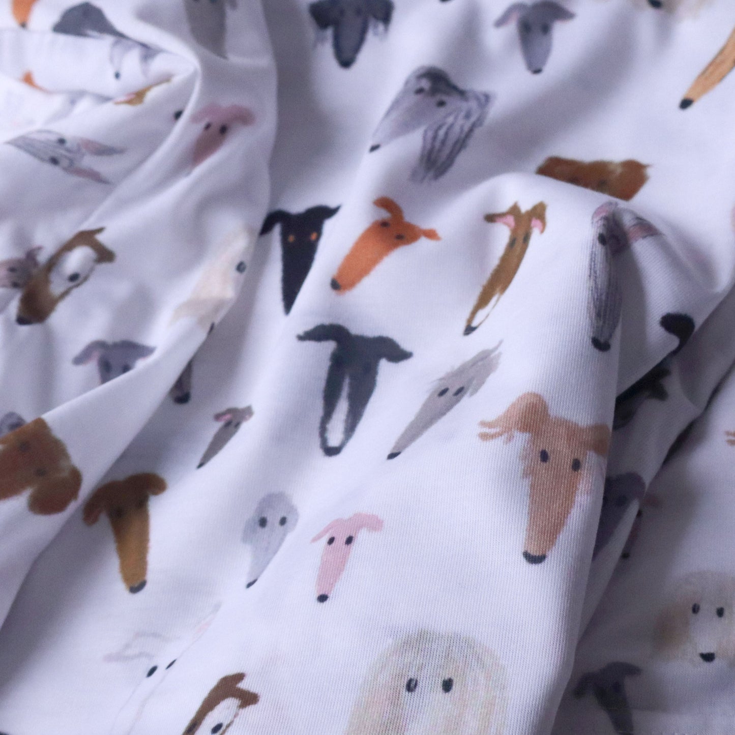 Fabric with sighthound pattern on a white background